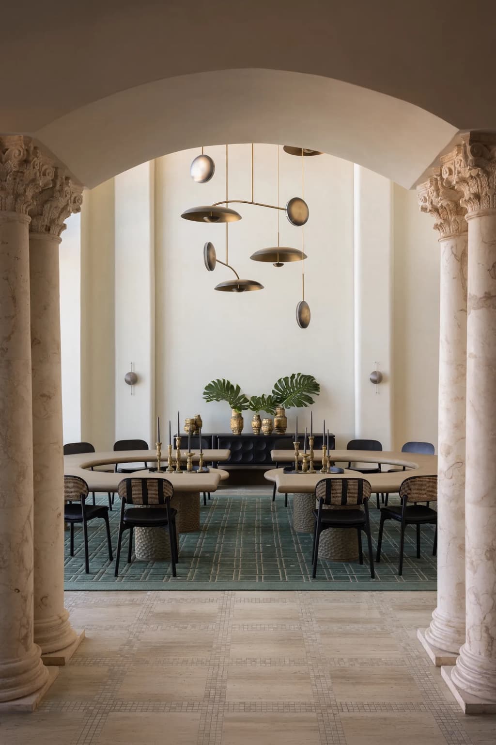 Dining room framed by stone columns and plaster walls