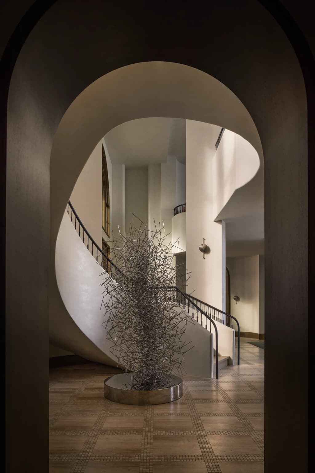 Curved plaster stair and sculptural interior